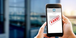 Fake Text Message Sms Scam Or Phishing Concept. Man Hands Using Smart Phone - Contabilidade em São Paulo | ECONSA Contabilidade e Gestão Empresarial