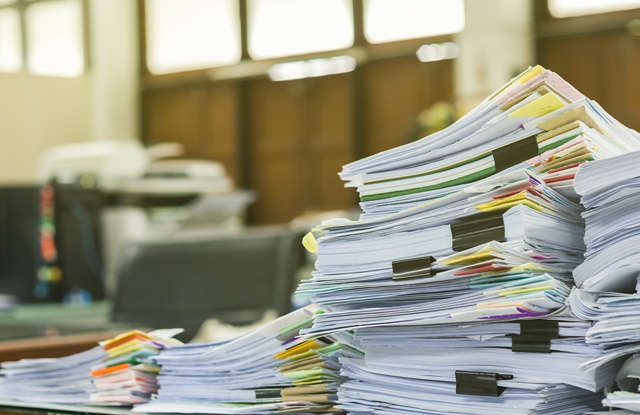 Pile Of Documents On Desk At Workplace - Contabilidade em São Paulo | ECONSA Contabilidade e Gestão Empresarial